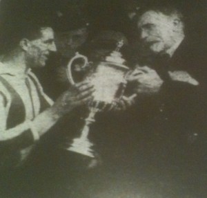 Captain Tommy Jennings collects the Cheshire Senior Cup from Edward Case, President of the Cheshire FA- Cheshire Observer