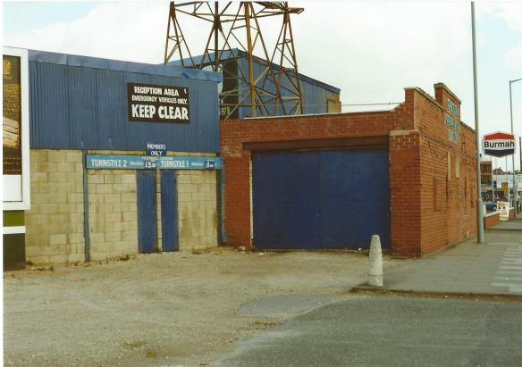 The Sealand Road End in 1990 showing the brickwork that was added in 1935. The plaque is just visible by the lamppost. Copyright © http://www.chesterfootballhistory.com 